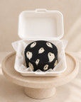 Black bento mini cake with hand-painted ghosts in a box