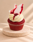Halloween red velvet muffin with vanilla cream and red sauce