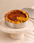 Pumpkin cheesecake in a can with a browned top, side view
