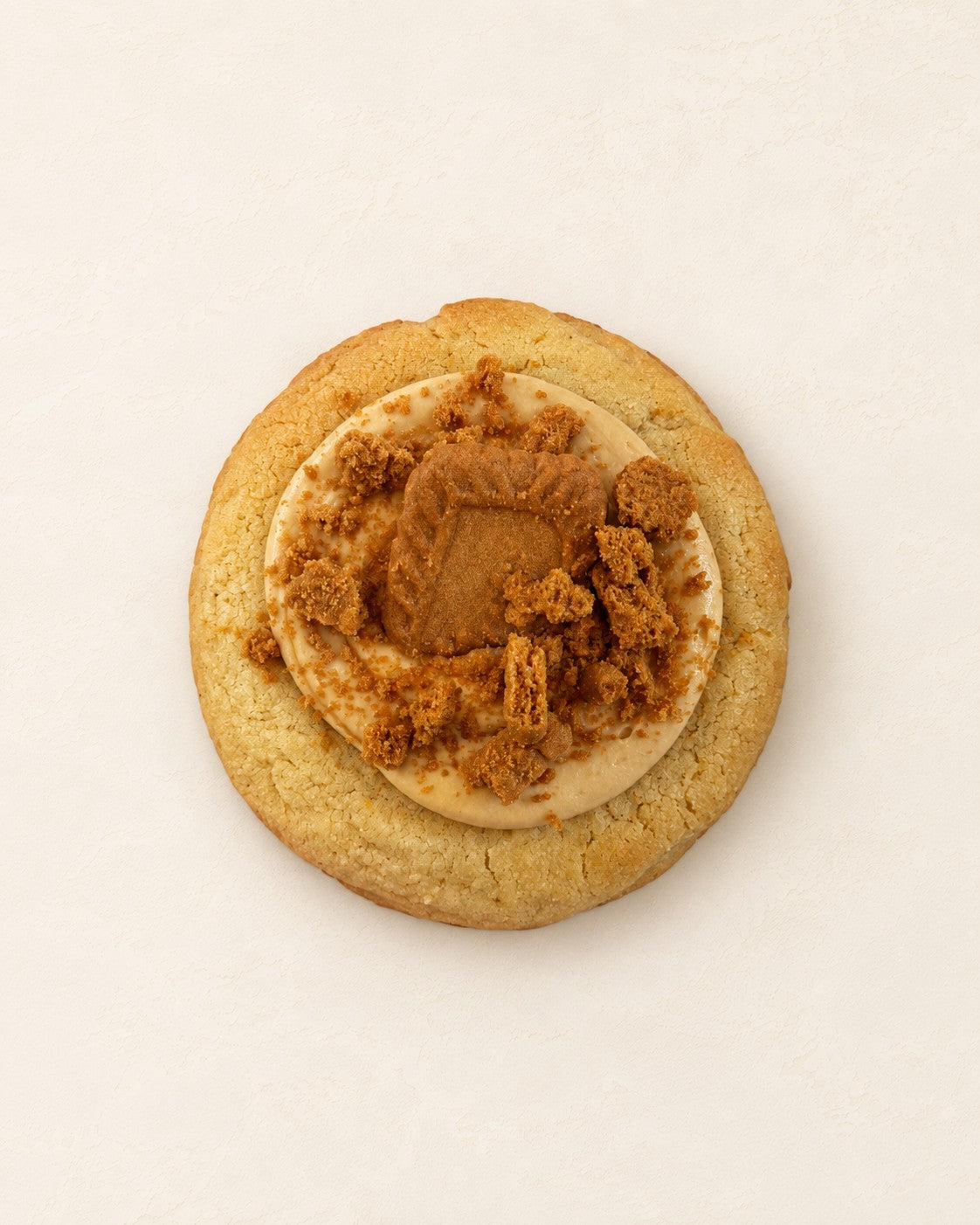 Lotus Cookie - white chocolate by Batida - crumble cookie with Lotus cream inside, a Lotus cream topping and biscuit crumbs