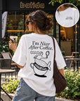 Batida I'm Nicer After Coffee T-shirt in front of a Batida café