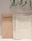 Write your letter by Batida - handwritten letter on textured paper in a string-and-washer envelope added to the parcel