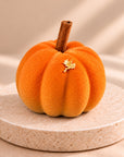 Orange Pumpkin Latte pumpkin with a cinnamon stick and a gold leaf flake