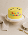 Gâteau Sourire de Batida - gâteau d'anniversaire jaune avec un smiley