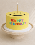 Gâteau Sourire de Batida - gâteau d'anniversaire jaune avec un smiley